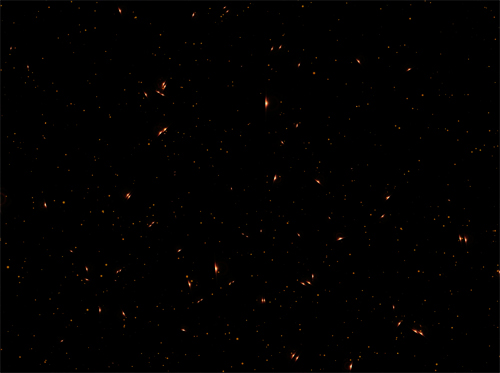 Golden glowing particles on a black background